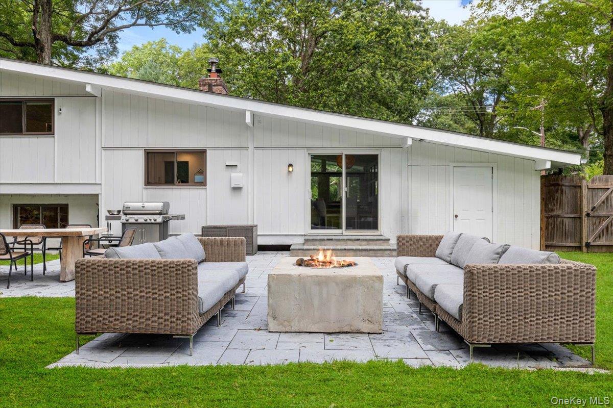 43 Winslow Road White Plains, NY 10606 - Photo 26 of 32 a outdoor living space with furniture and a fireplace