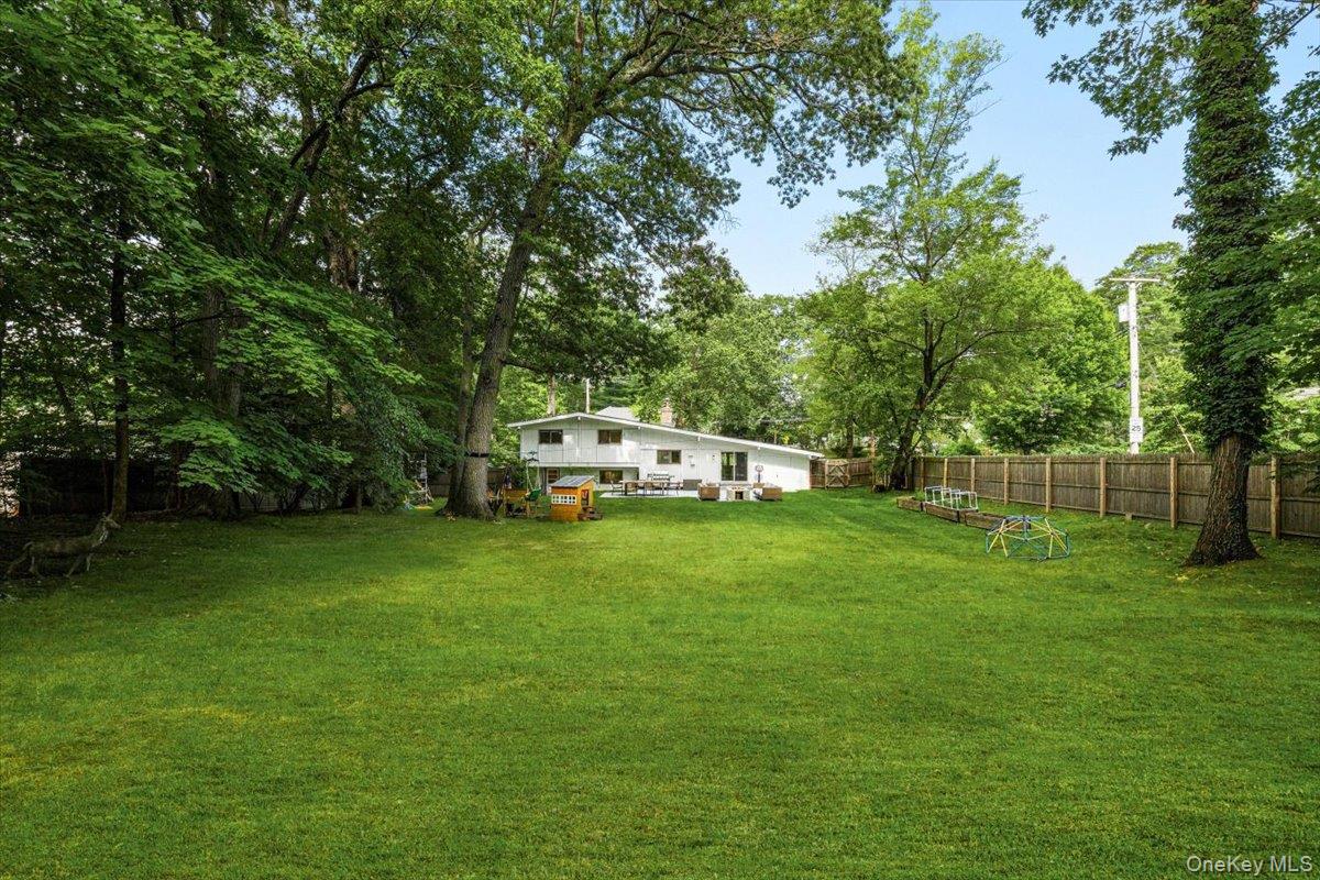 43 Winslow Road White Plains, NY 10606 - Photo 28 of 32 a white house in middle of the forest