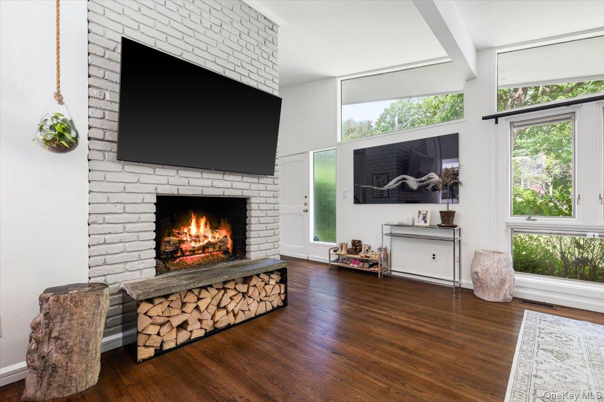 43 Winslow Road White Plains, NY 10606 - Photo 7 of 32 a living room with furniture a flat screen tv and a fireplace