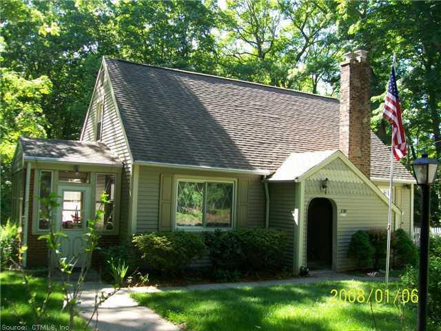 830 Dogburn Road Orange, CT 06477 - Photo 1 of 1 a front view of a house with garden