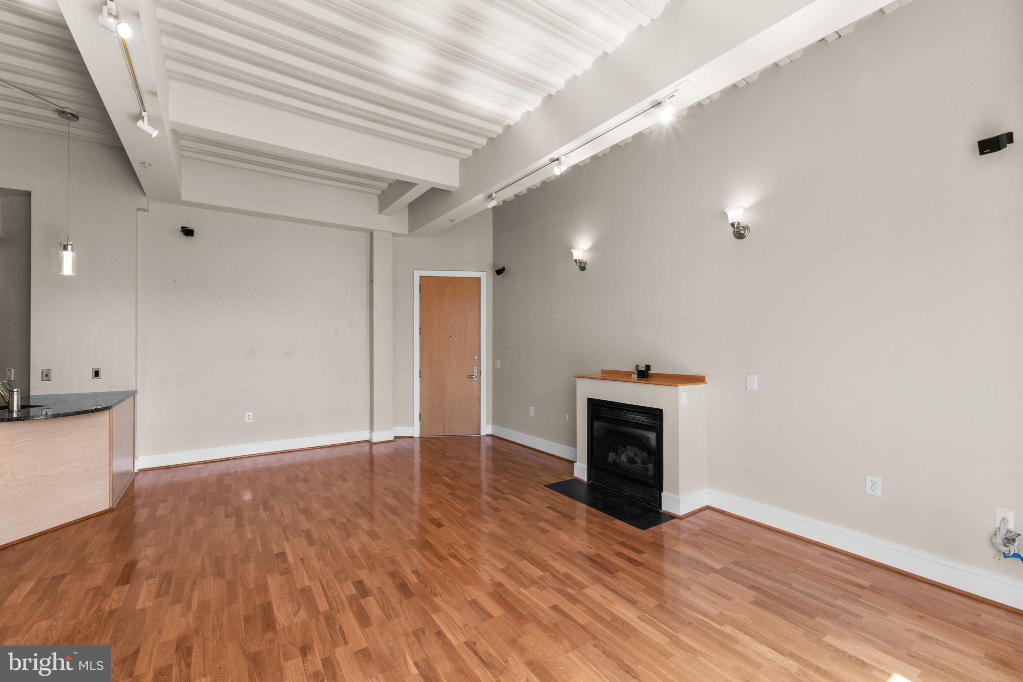 1320 13th Street Northwest, Unit 21 Washington, DC 20005 - Photo 11 of 41 Living and dining area w/ fireplace