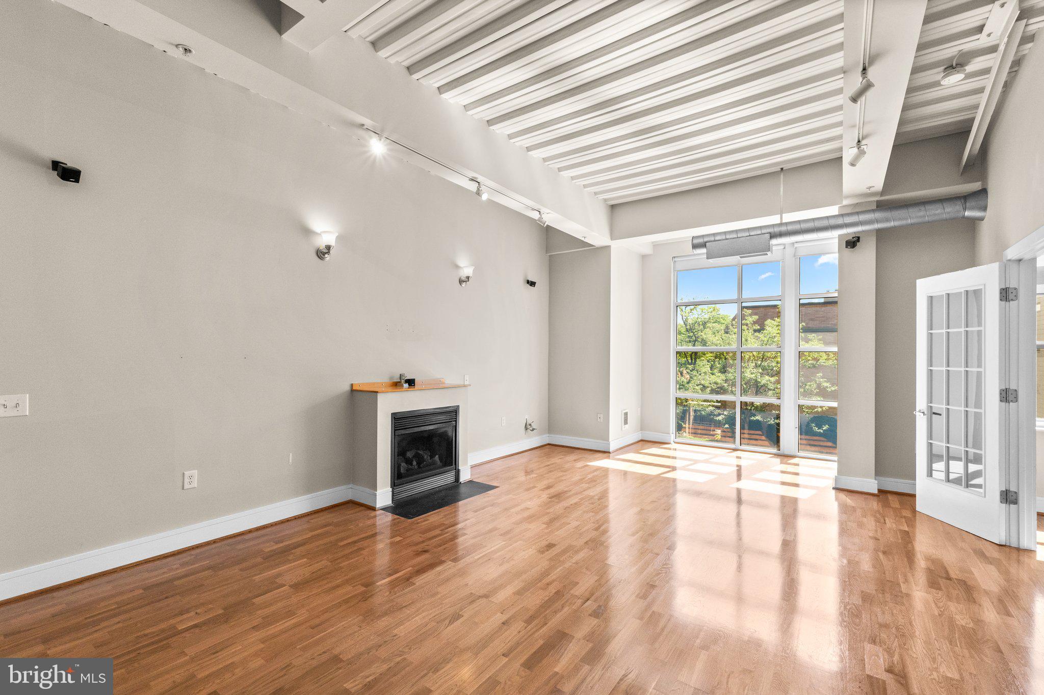 1320 13th Street Northwest, Unit 21 Washington, DC 20005 - Photo 12 of 41 Living and dining area w/ gas fireplace