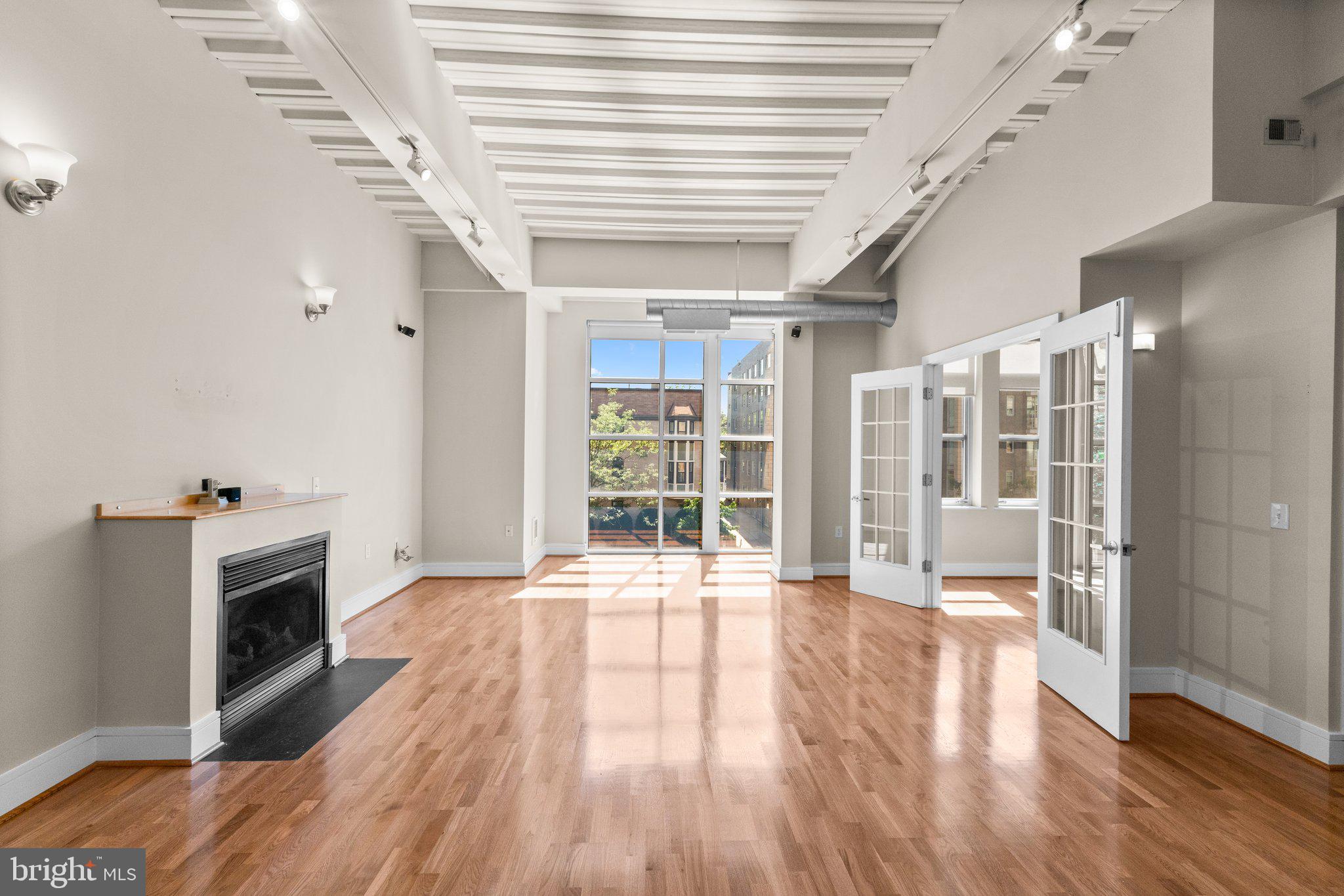 1320 13th Street Northwest, Unit 21 Washington, DC 20005 - Photo 6 of 41 Living and dining area w/ gas fireplace