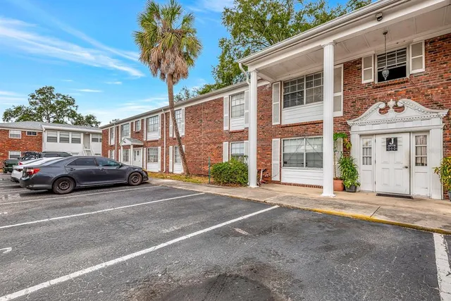a view of a car parked in front of a building