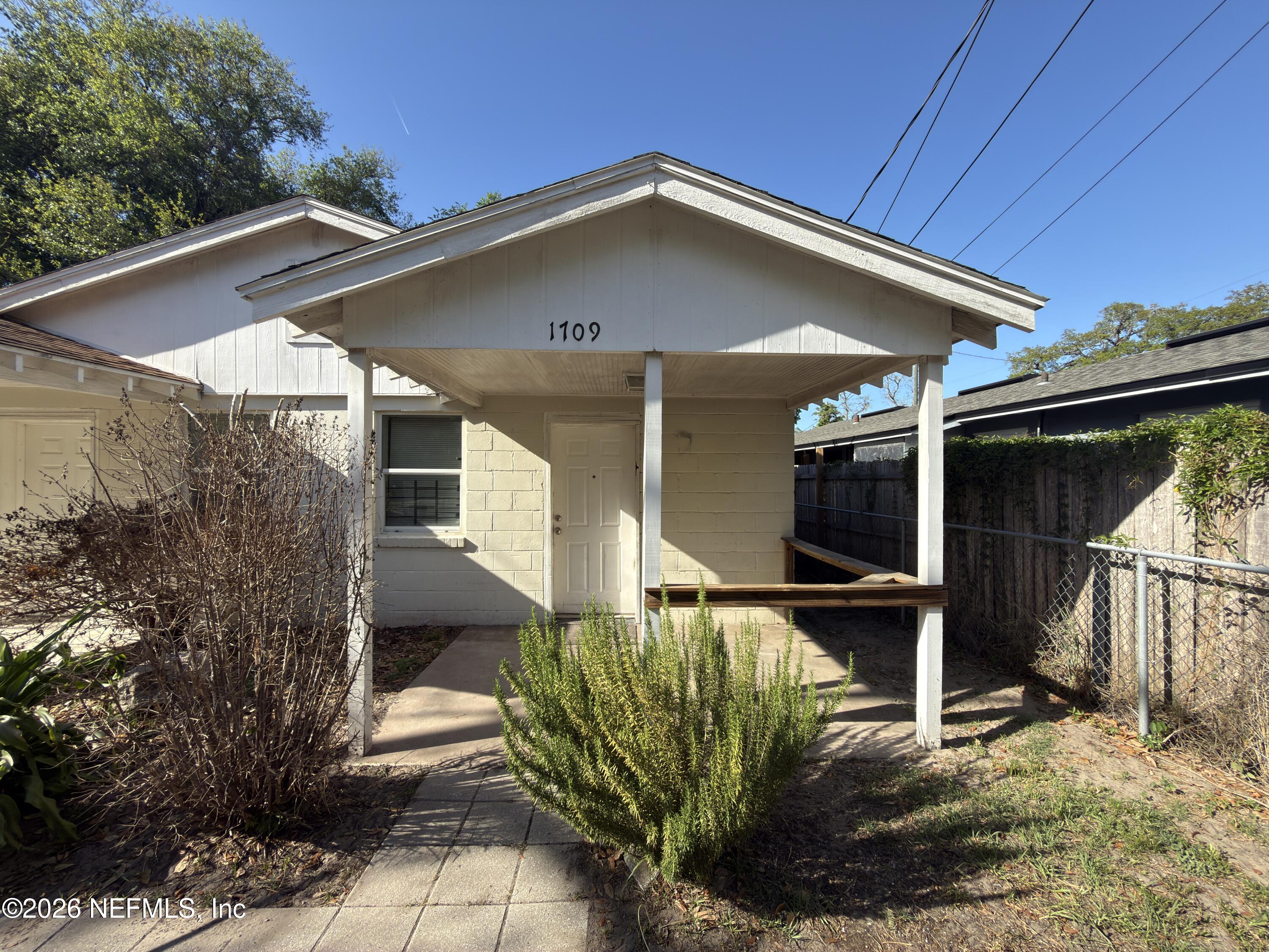 1709 Dot Street Jacksonville, FL 32209 - Photo 1 of 17 a front view of a house with garden