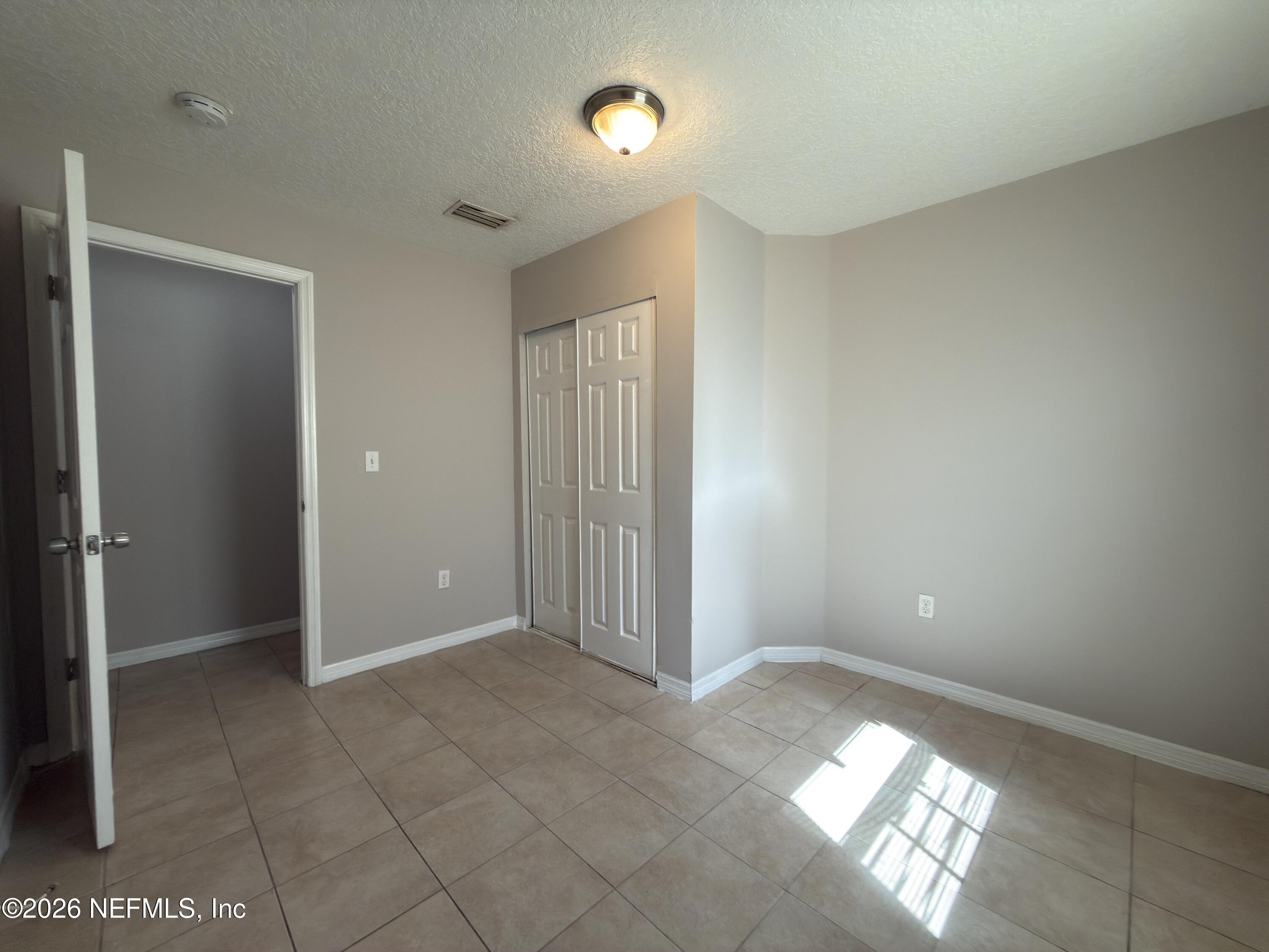 1709 Dot Street Jacksonville, FL 32209 - Photo 11 of 17 a view of an empty room and window