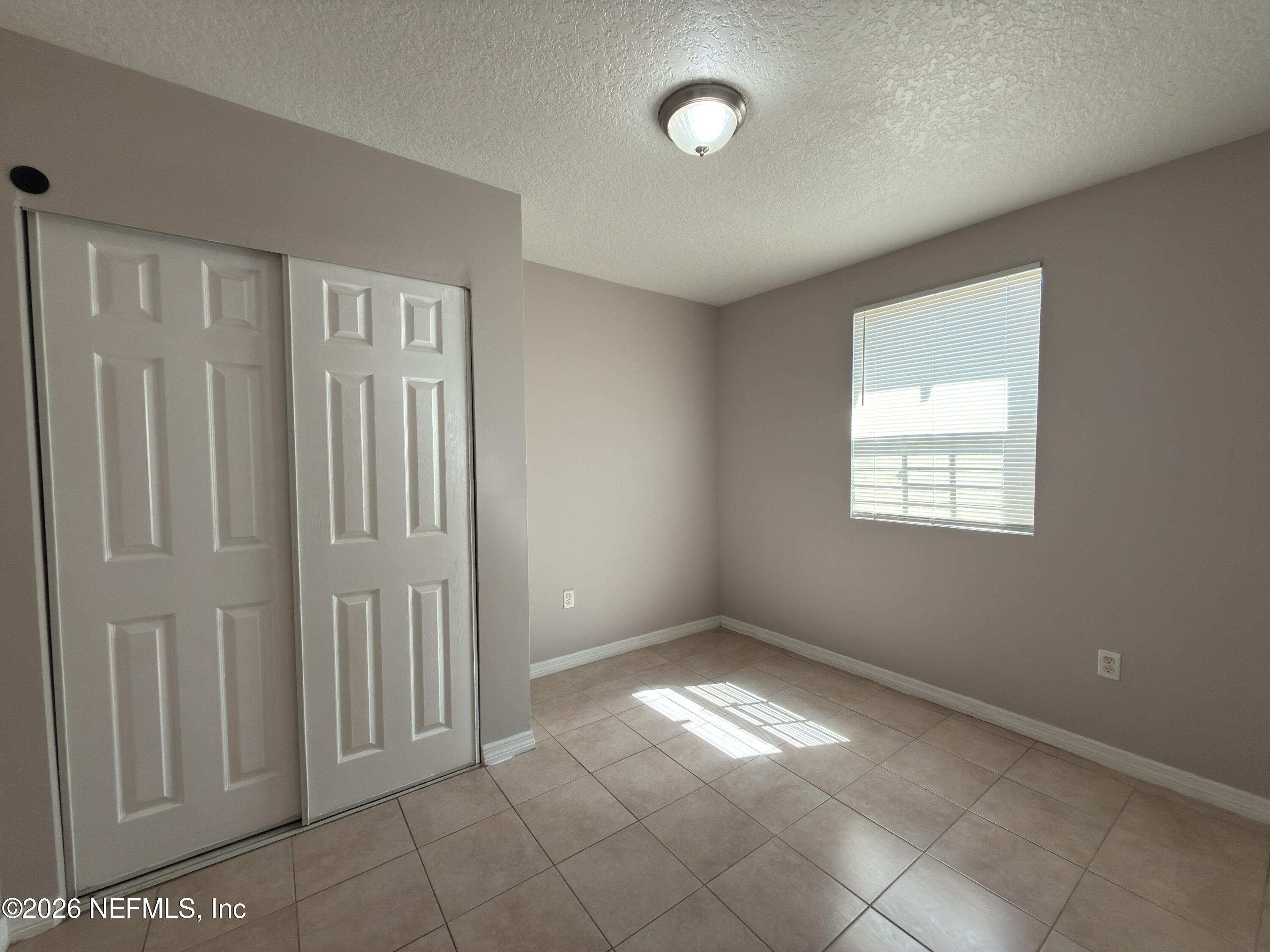 1709 Dot Street Jacksonville, FL 32209 - Photo 12 of 17 an empty room with windows