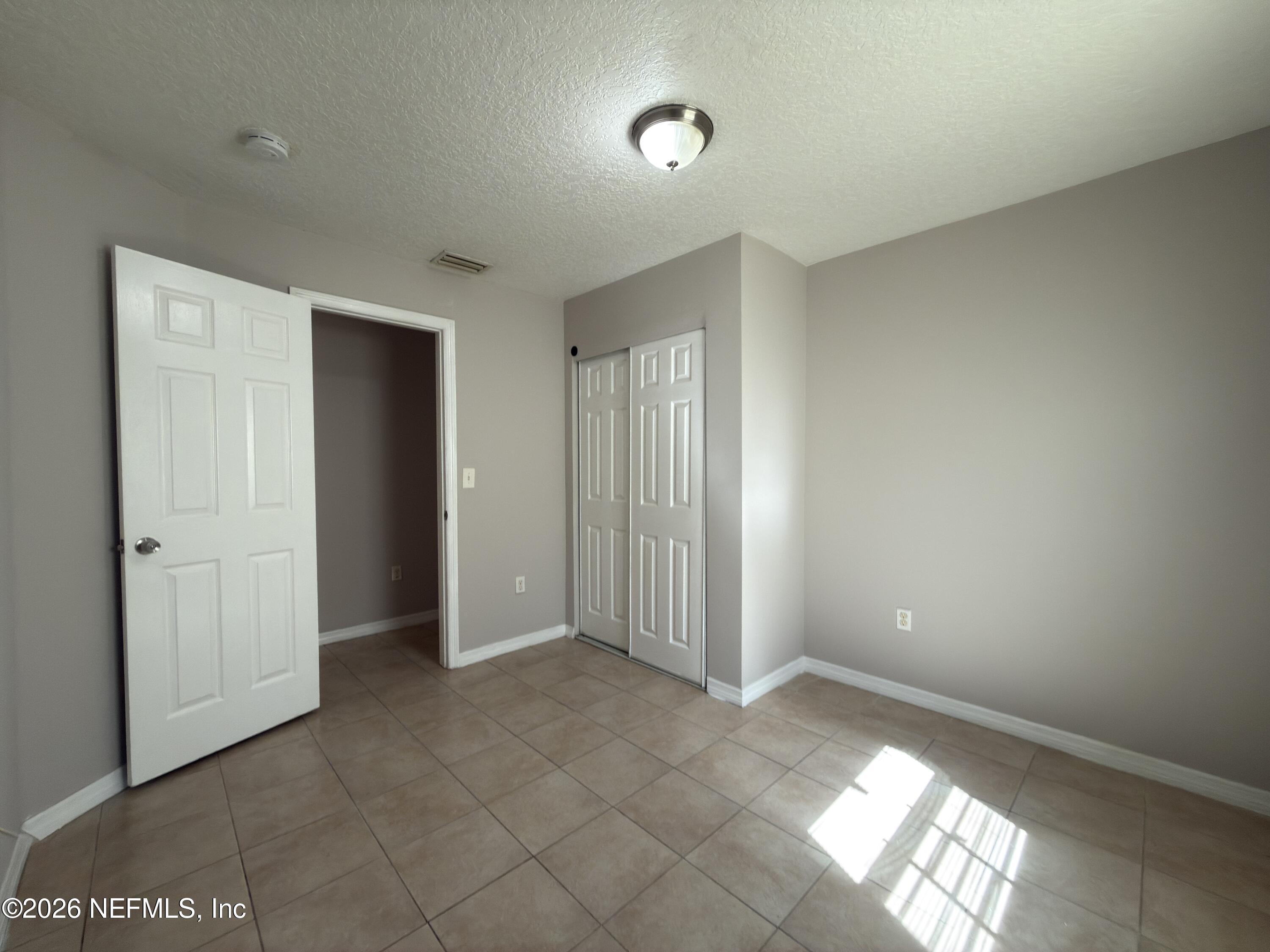 1709 Dot Street Jacksonville, FL 32209 - Photo 13 of 17 a view of an empty room and window
