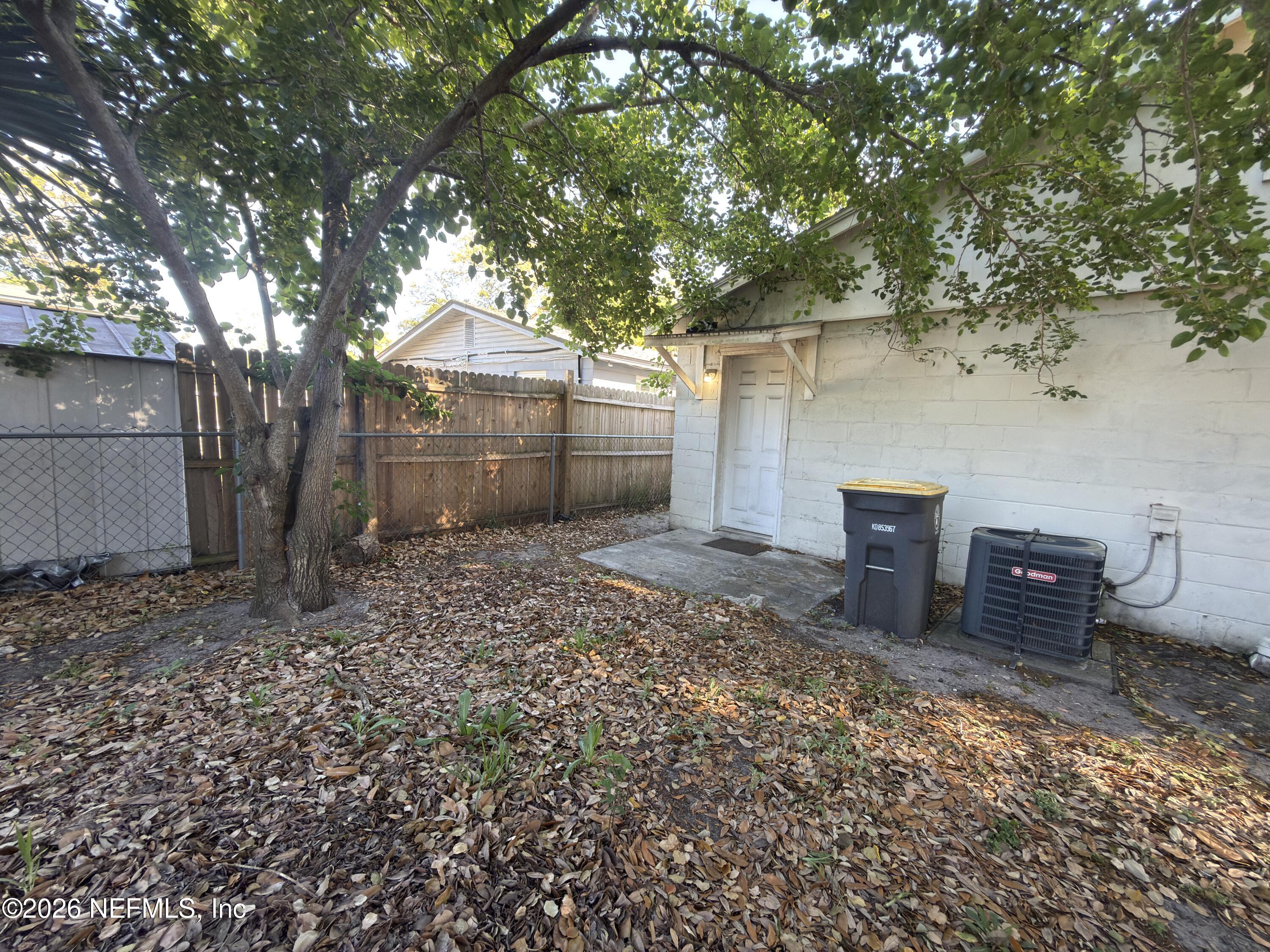 1709 Dot Street Jacksonville, FL 32209 - Photo 15 of 17 a backyard of a house with table and chairs