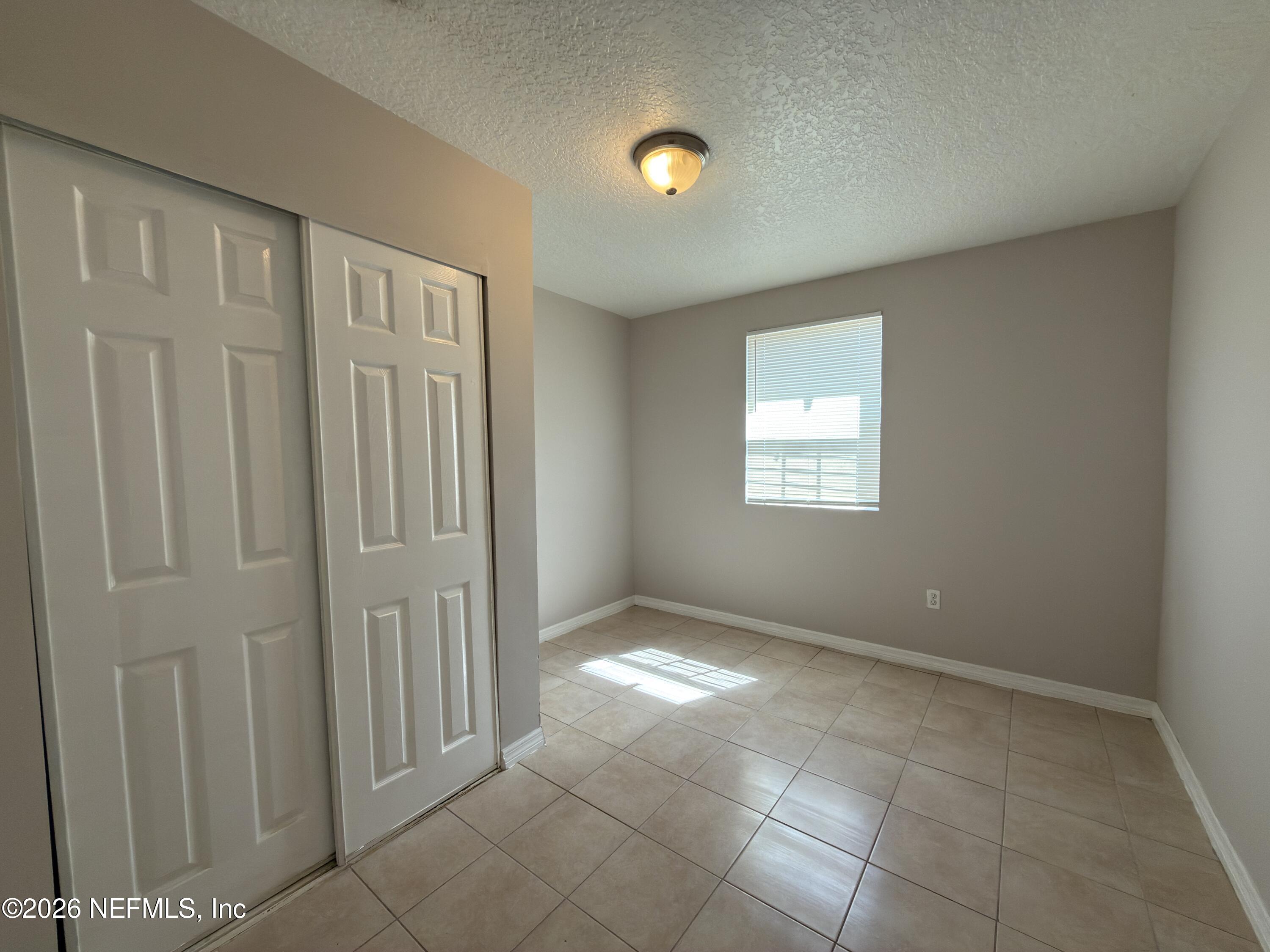 1709 Dot Street Jacksonville, FL 32209 - Photo 10 of 17 an empty room with windows