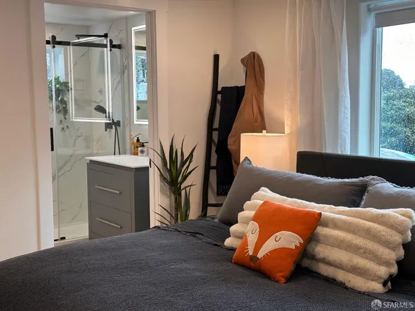 a bedroom with a bed and a dresser