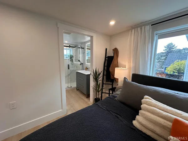 a view of a livingroom with furniture and a window