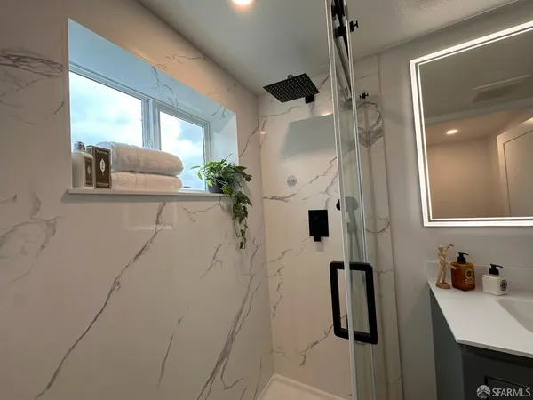 a bathroom with a sink and mirror