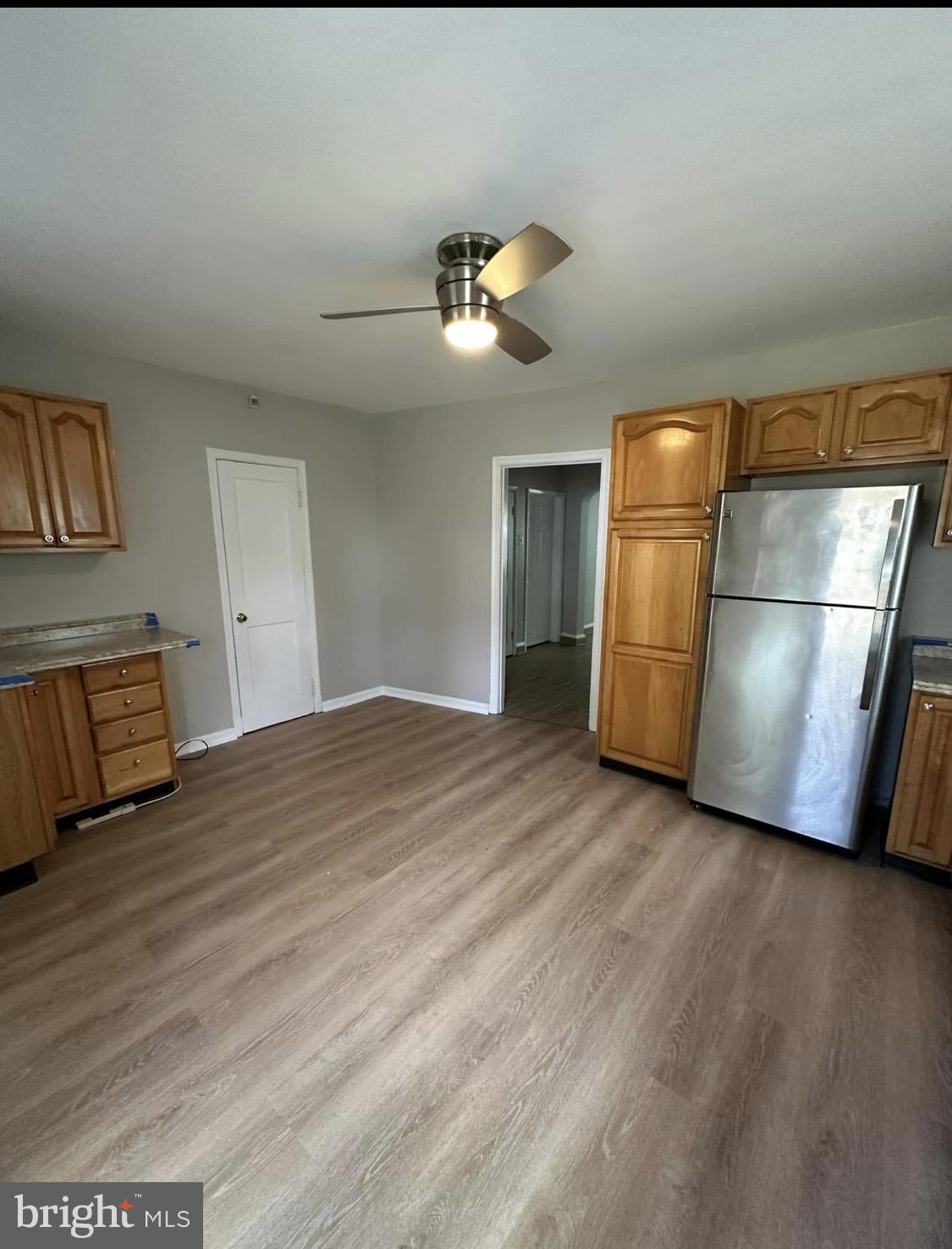9904 Harford Road Baltimore, MD 21234 - Photo 2 of 15 a view of empty room with wooden floor