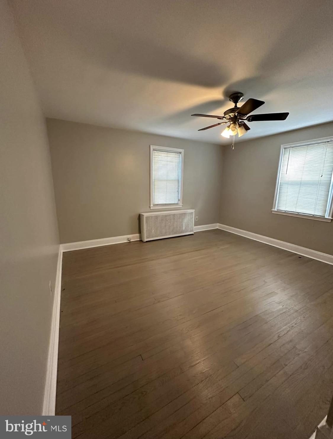 9904 Harford Road Baltimore, MD 21234 - Photo 8 of 15 an empty room with a empty space and a ceiling fan