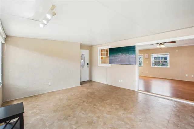 a view of an empty room with a window