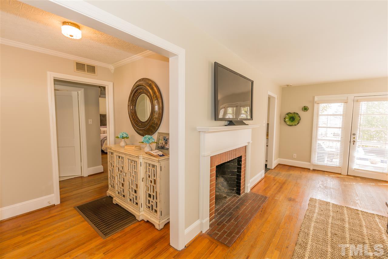 710 East Whitaker Mill Road Raleigh, NC 27608 - Photo 14 of 25 a view of an empty room with glass door and wooden floor