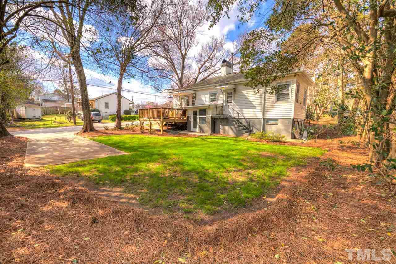 710 East Whitaker Mill Road Raleigh, NC 27608 - Photo 18 of 25 a view of a yard with a tree