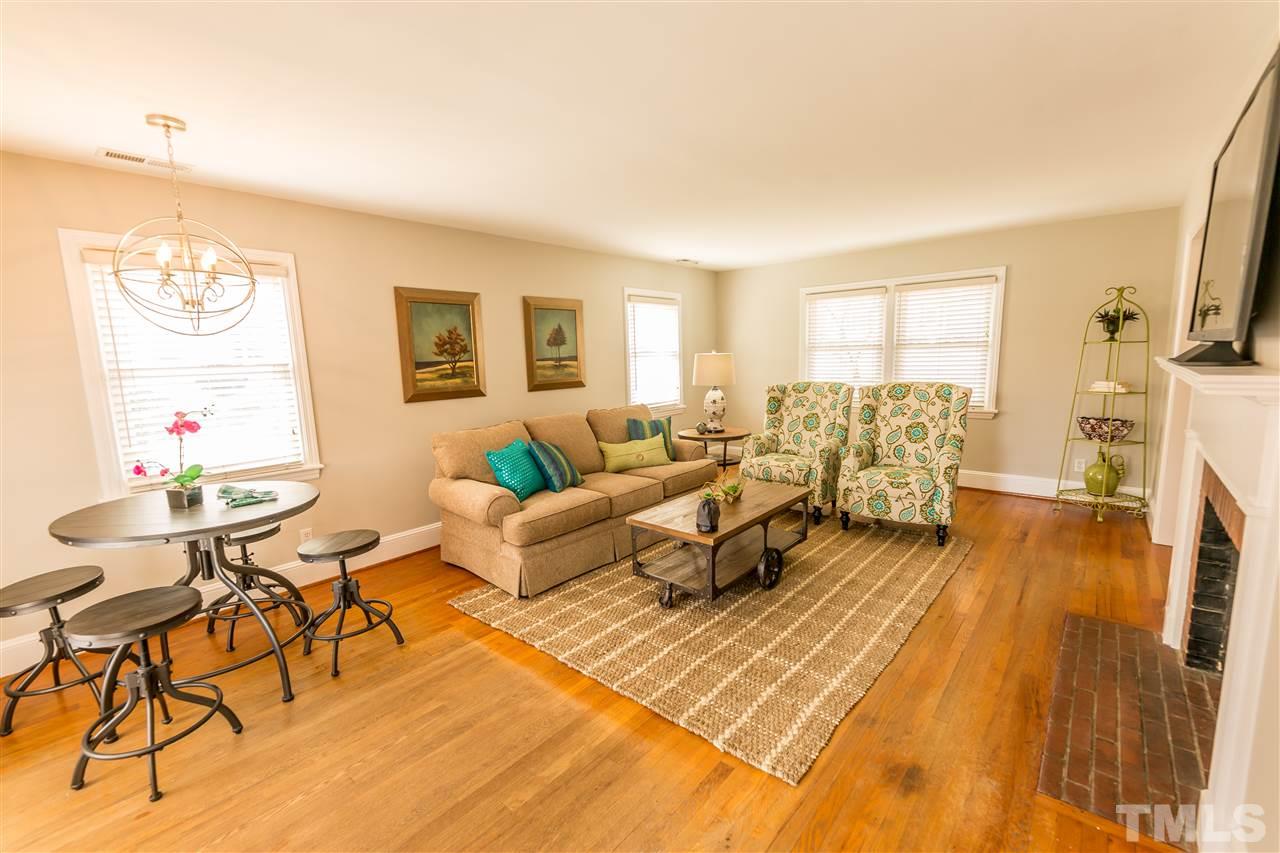 710 East Whitaker Mill Road Raleigh, NC 27608 - Photo 9 of 25 a living room with furniture and a fireplace