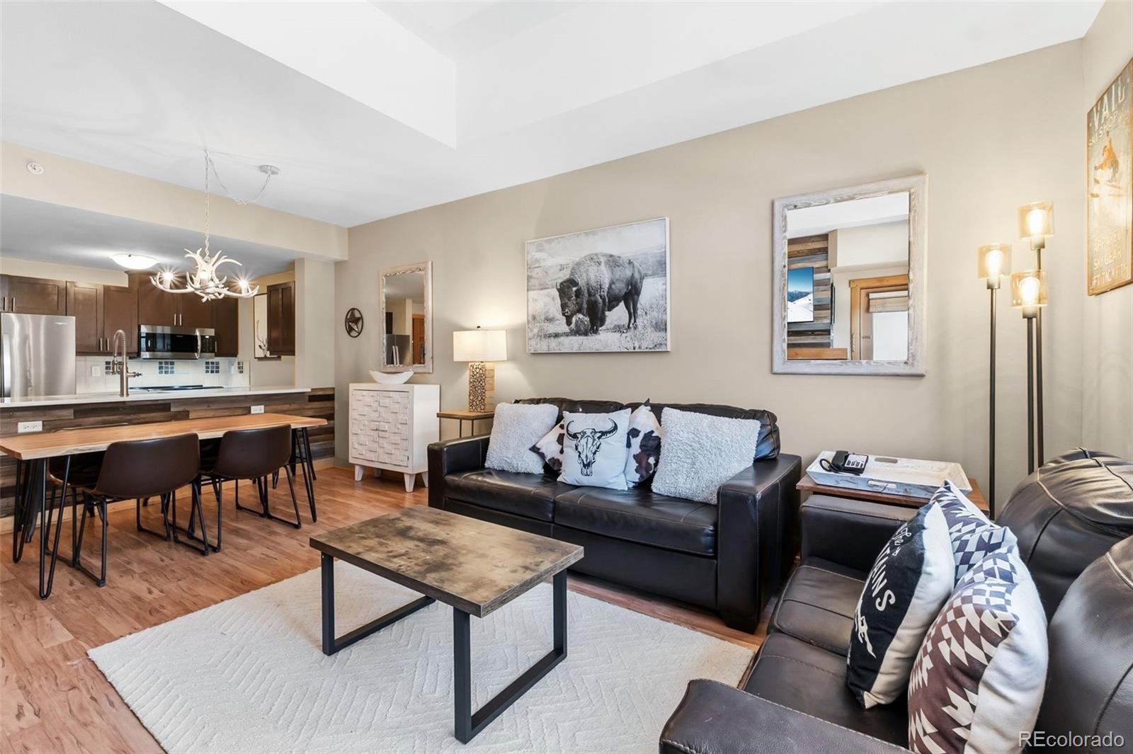 910 Copper Road, Unit 621 Frisco, CO 80443 - Photo 11 of 31 a living room with furniture potted plant and a table