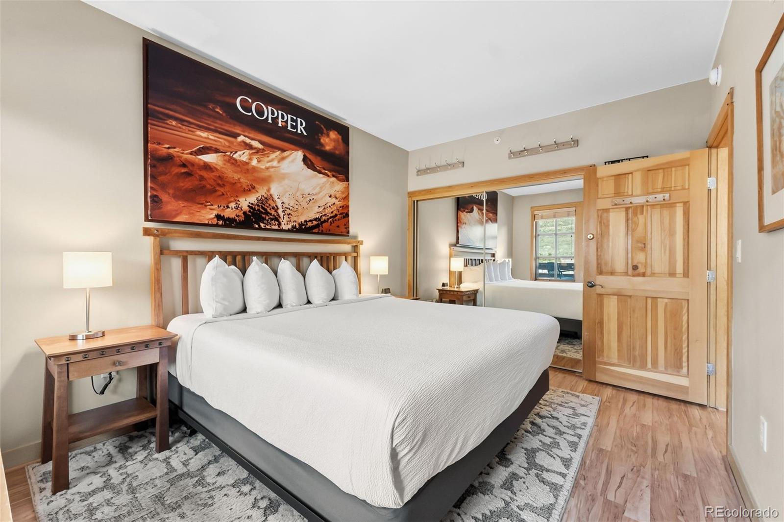 910 Copper Road, Unit 621 Frisco, CO 80443 - Photo 15 of 31 a large bed sitting in a bedroom next to a window