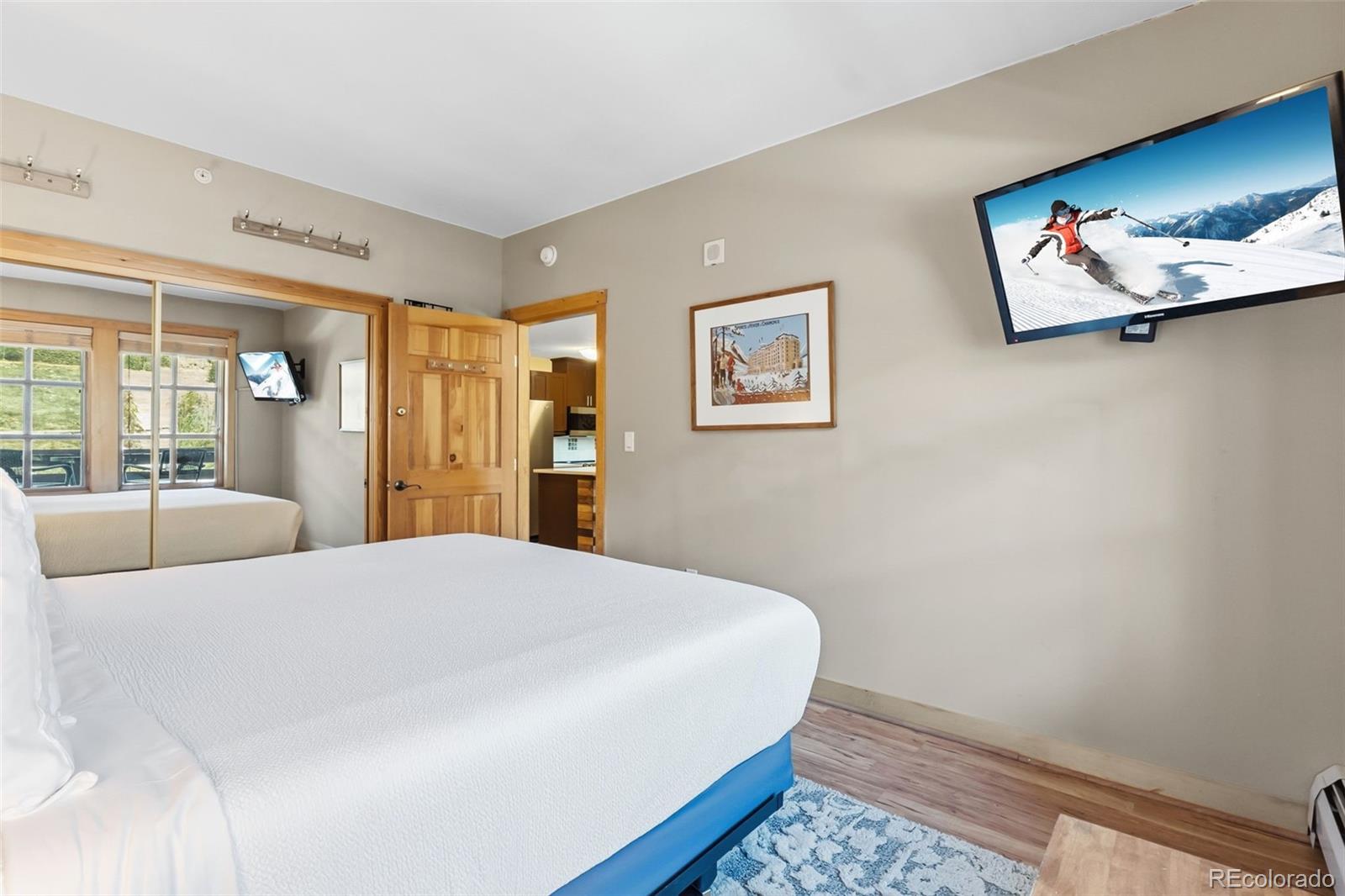 910 Copper Road, Unit 621 Frisco, CO 80443 - Photo 17 of 31 a bedroom with a bed and a painting on the wall