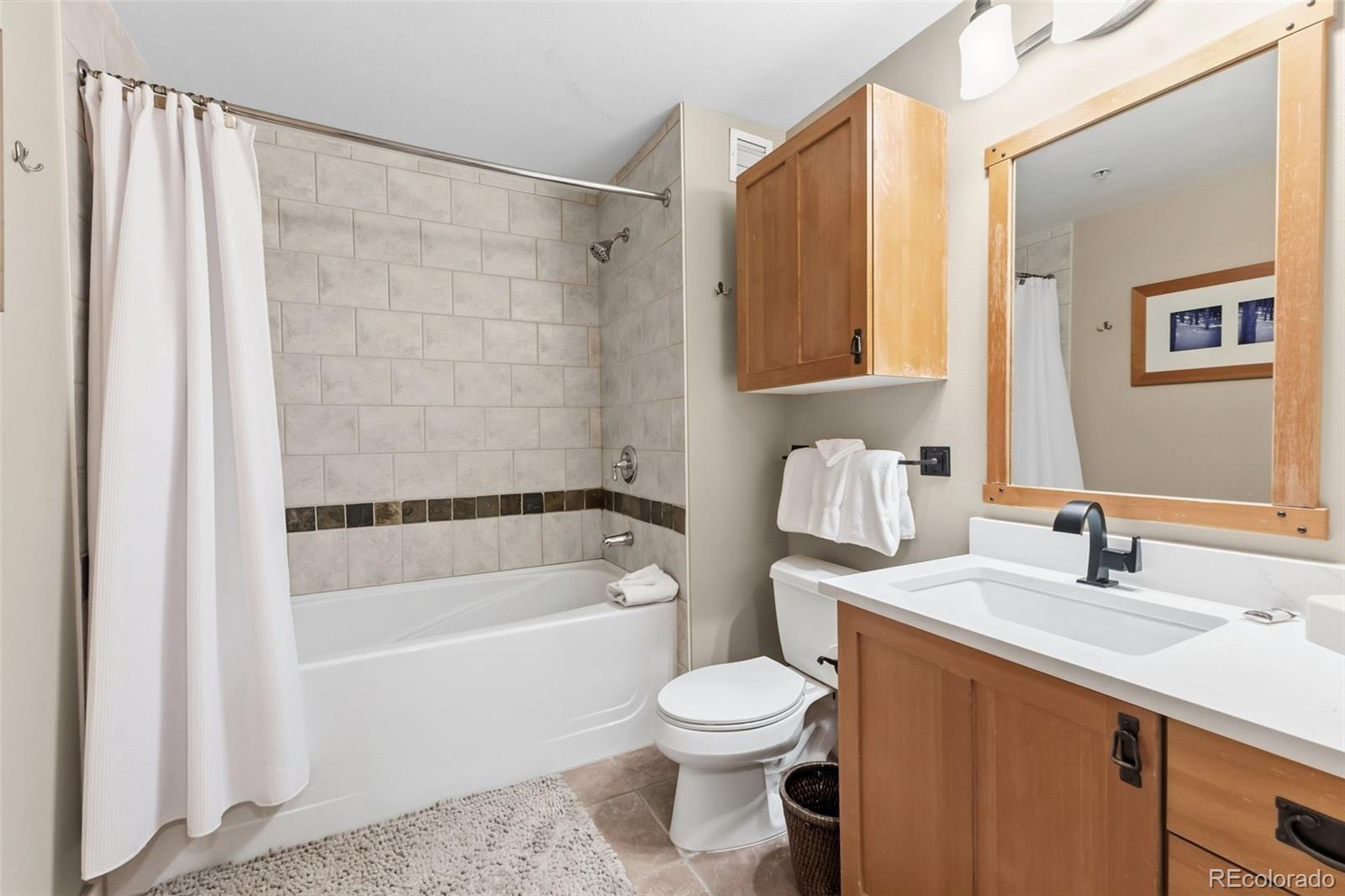 910 Copper Road, Unit 621 Frisco, CO 80443 - Photo 19 of 31 a bathroom with a sink toilet and shower