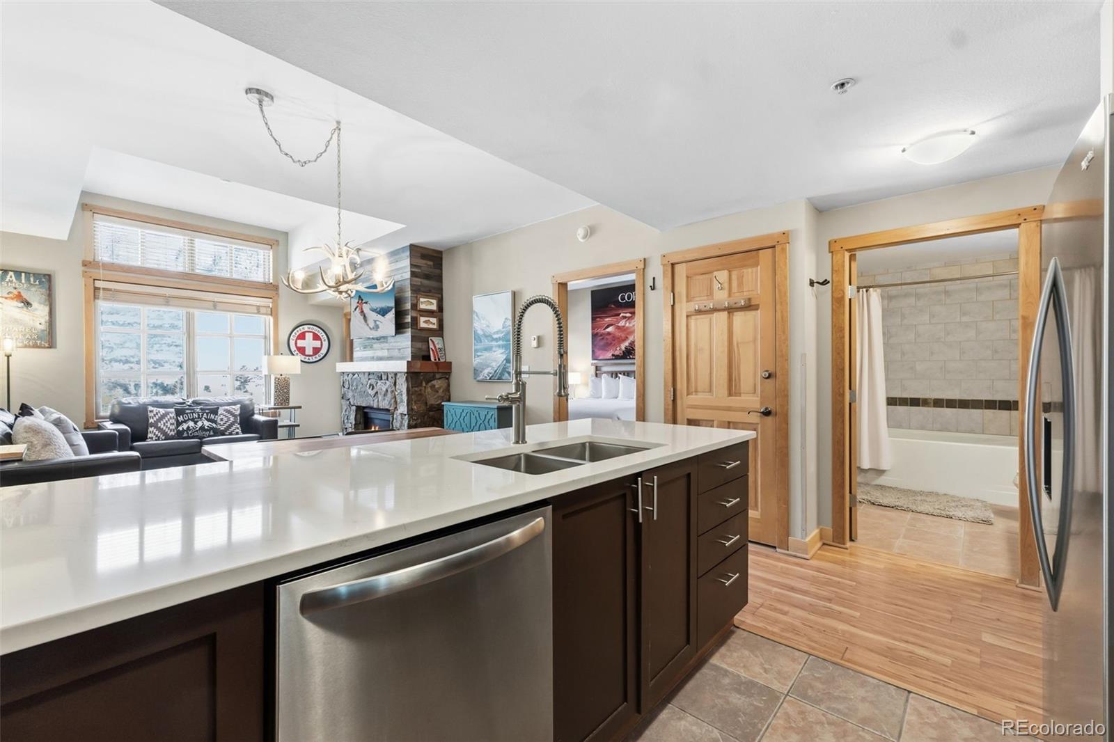910 Copper Road, Unit 621 Frisco, CO 80443 - Photo 5 of 31 a kitchen with granite countertop a sink and cabinets