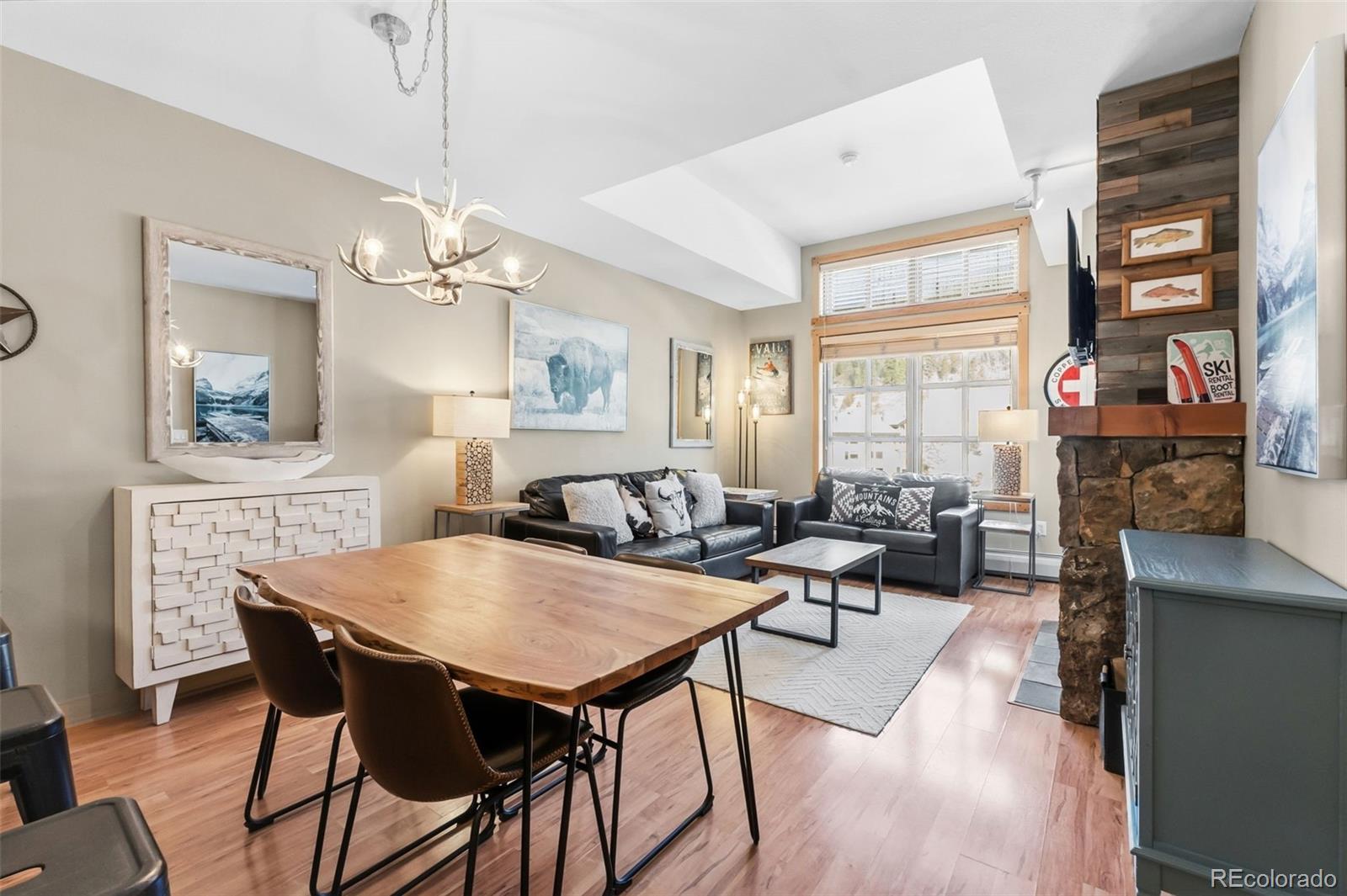 910 Copper Road, Unit 621 Frisco, CO 80443 - Photo 7 of 31 a view of a dining room with furniture window and wooden floor