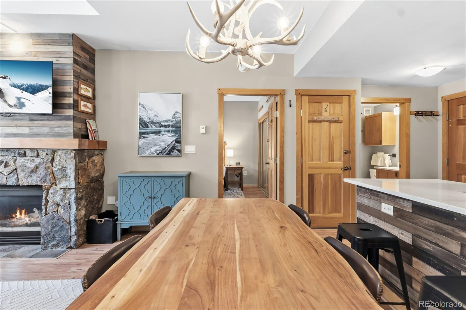 910 Copper Road, Unit 621 Frisco, CO 80443 - Photo 10 of 31 a spacious bedroom with a bed and a fireplace