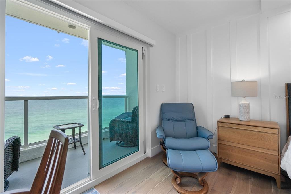 1050 Longboat Club Road, Unit 901 Longboat Key, FL 34228 - Photo 17 of 37 a bedroom with furniture and a large window