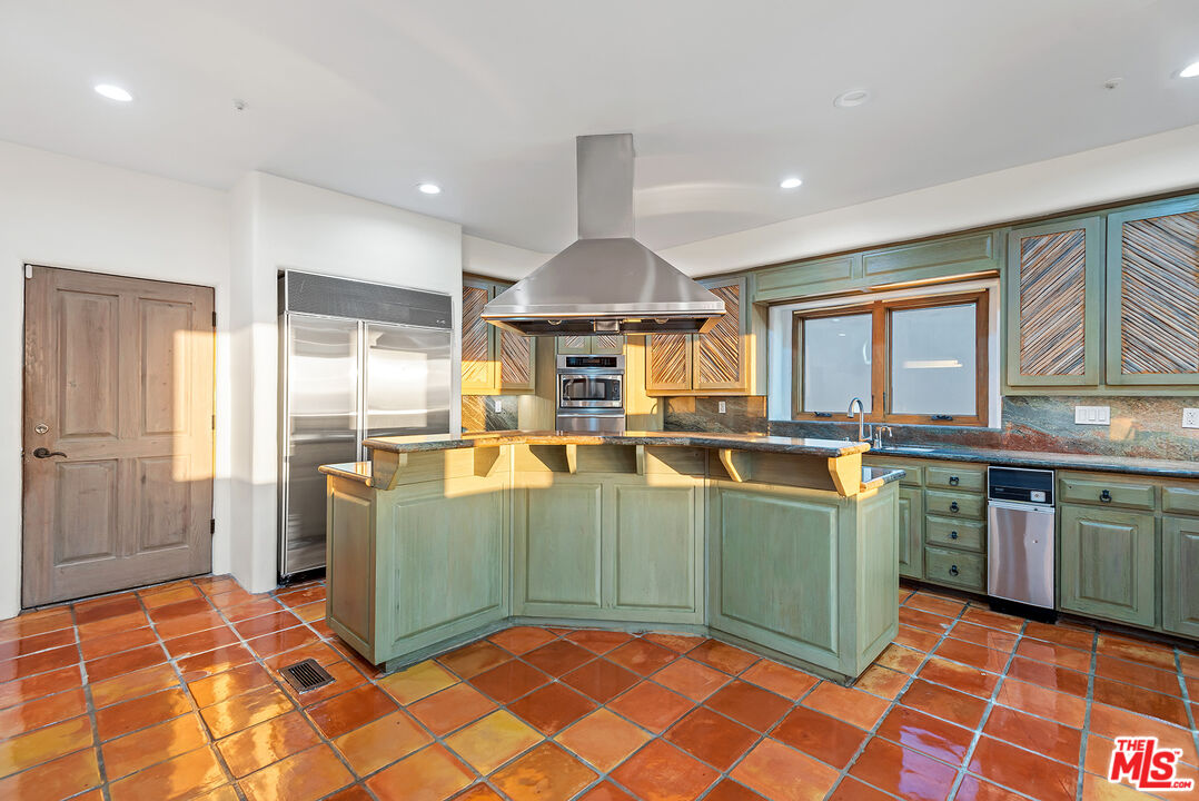 7047 Vista Del Mar Lane Playa del Rey, CA 90293 - Photo 12 of 75 a kitchen with stainless steel appliances granite countertop a sink and a refrigerator