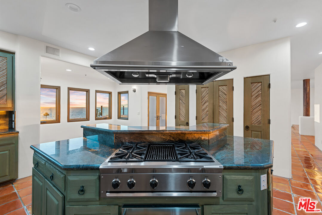 7047 Vista Del Mar Lane Playa del Rey, CA 90293 - Photo 14 of 75 a stove top oven sitting inside of a kitchen