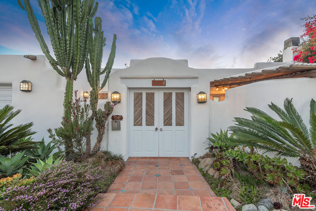 7047 Vista Del Mar Lane Playa del Rey, CA 90293 - Photo 2 of 75 a front view of a house with garden