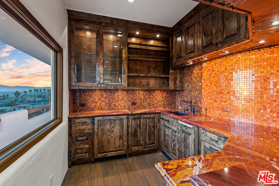 7047 Vista Del Mar Lane Playa del Rey, CA 90293 - Photo 25 of 75 a kitchen with stainless steel appliances granite countertop a sink and wooden cabinets