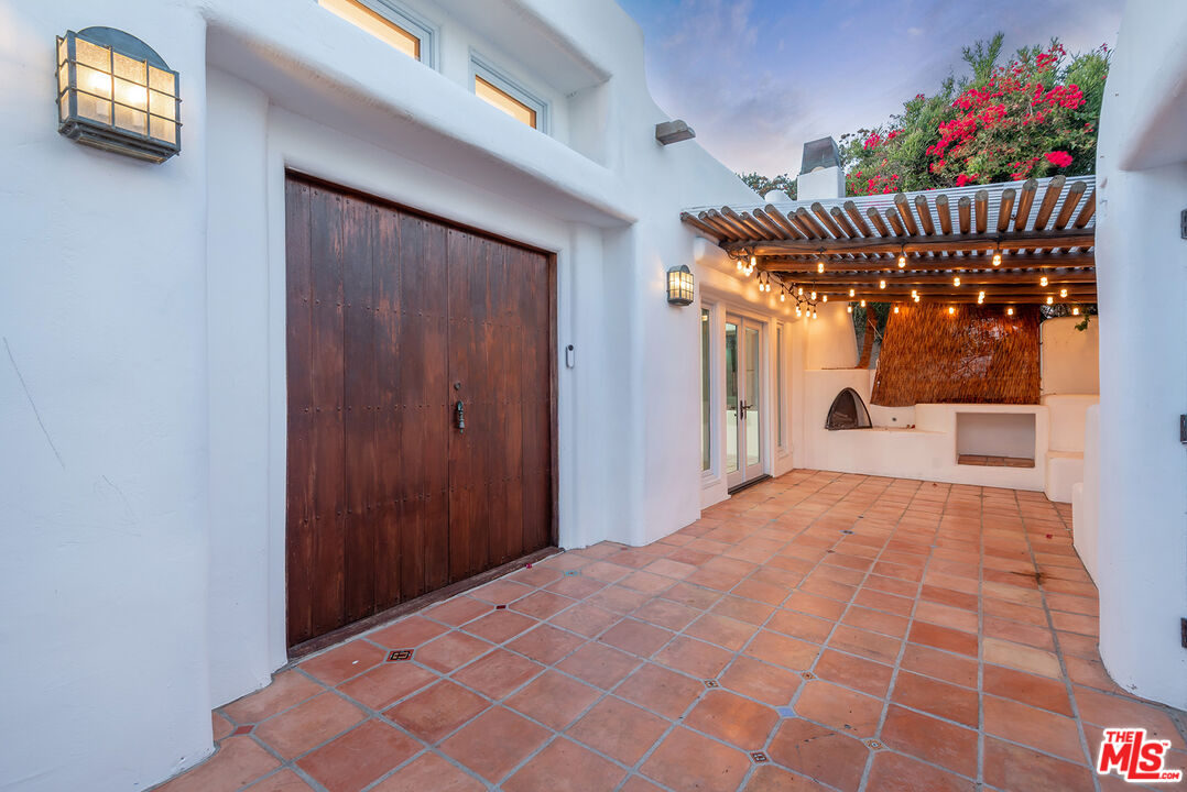 7047 Vista Del Mar Lane Playa del Rey, CA 90293 - Photo 3 of 75 a view of a hallway with a flower pot and wooden floor