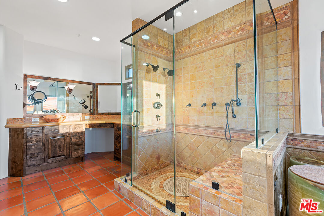 7047 Vista Del Mar Lane Playa del Rey, CA 90293 - Photo 32 of 75 a bathroom with a tub sink and mirror