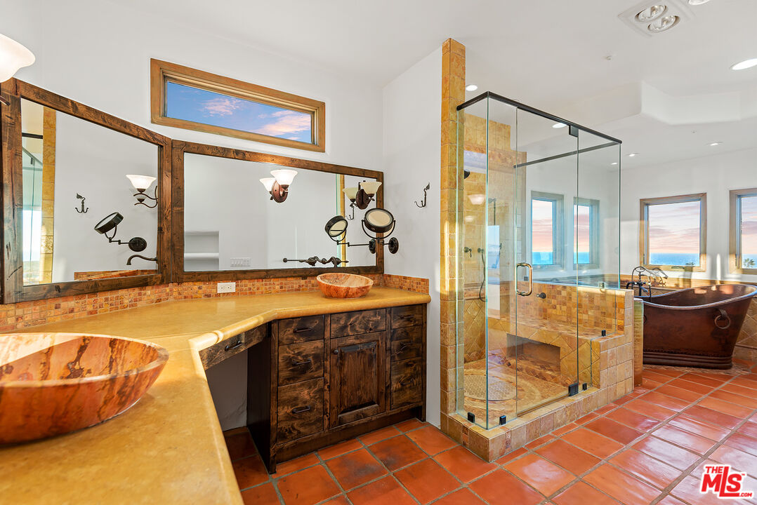 7047 Vista Del Mar Lane Playa del Rey, CA 90293 - Photo 34 of 75 a spacious bathroom with a tub sink and mirror