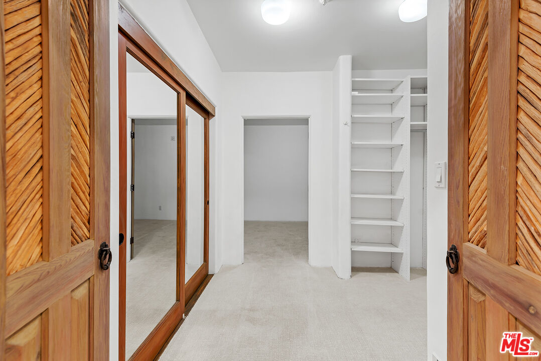 7047 Vista Del Mar Lane Playa del Rey, CA 90293 - Photo 36 of 75 a view of walk in closet with empty racks