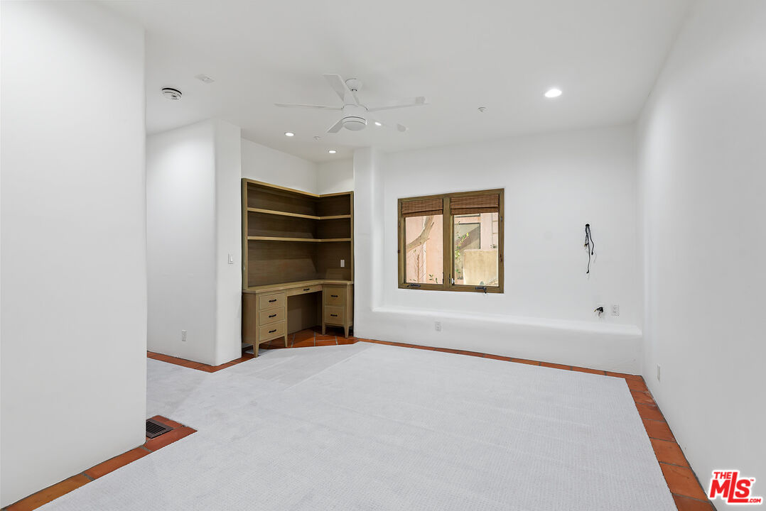 7047 Vista Del Mar Lane Playa del Rey, CA 90293 - Photo 45 of 75 an empty room with a fireplace and windows