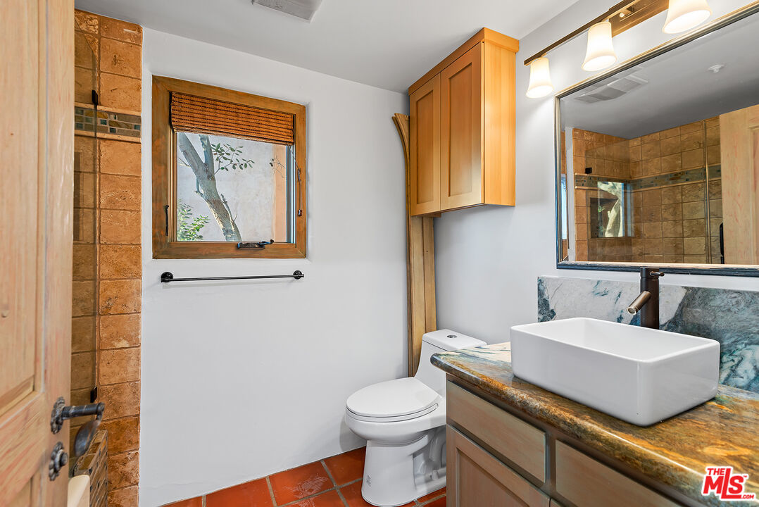 7047 Vista Del Mar Lane Playa del Rey, CA 90293 - Photo 47 of 75 a bathroom with a sink a toilet and mirror