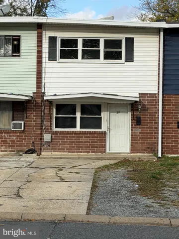 a house that has a window in front of it