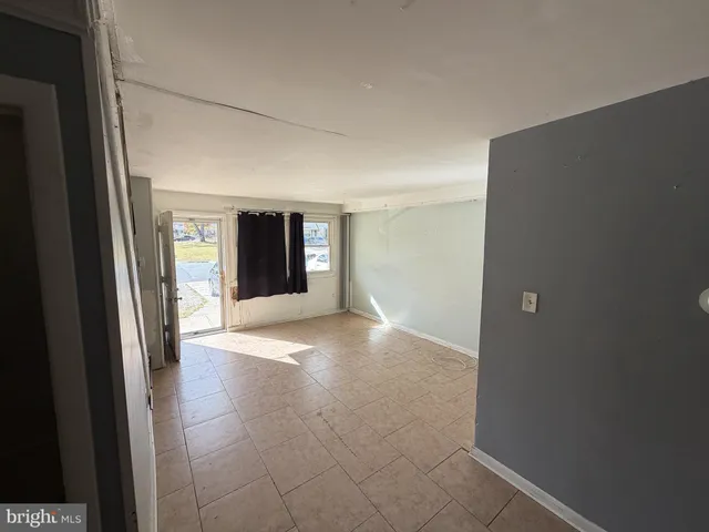 a view of a big room with windows and wardrobe