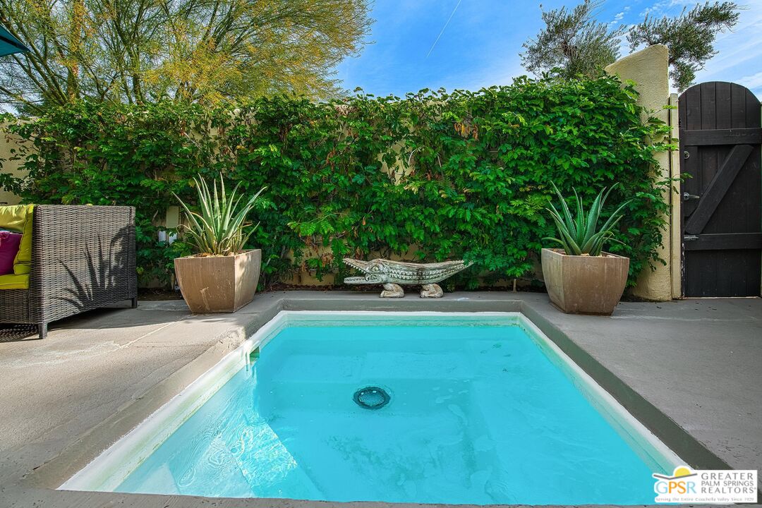 1177 East Alejo Road Palm Springs, CA 92262 - Photo 16 of 33 a view of a backyard with sitting area