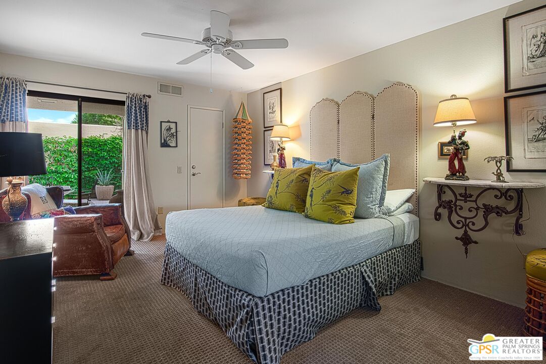 1177 East Alejo Road Palm Springs, CA 92262 - Photo 21 of 33 a bedroom with a bed couch and window