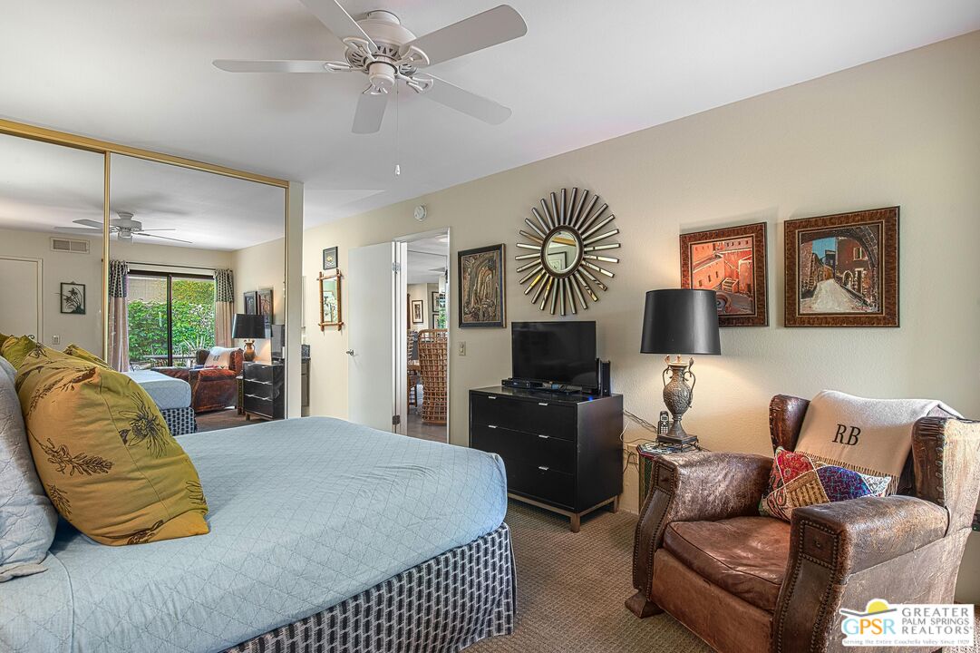 1177 East Alejo Road Palm Springs, CA 92262 - Photo 22 of 33 a bedroom with a bed and couch