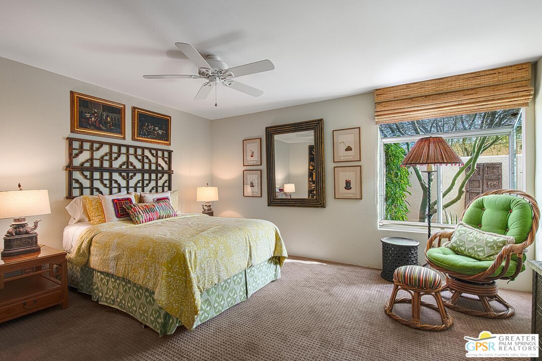 1177 East Alejo Road Palm Springs, CA 92262 - Photo 24 of 33 a bedroom with a bed and a large window