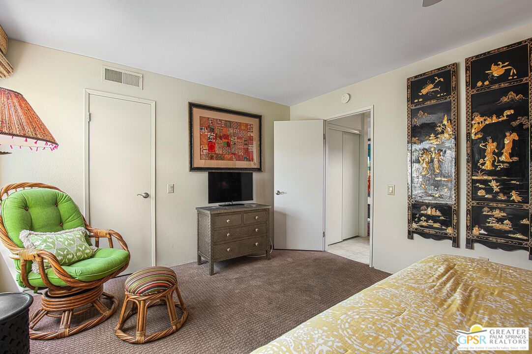 1177 East Alejo Road Palm Springs, CA 92262 - Photo 25 of 33 a bedroom with furniture and a bed