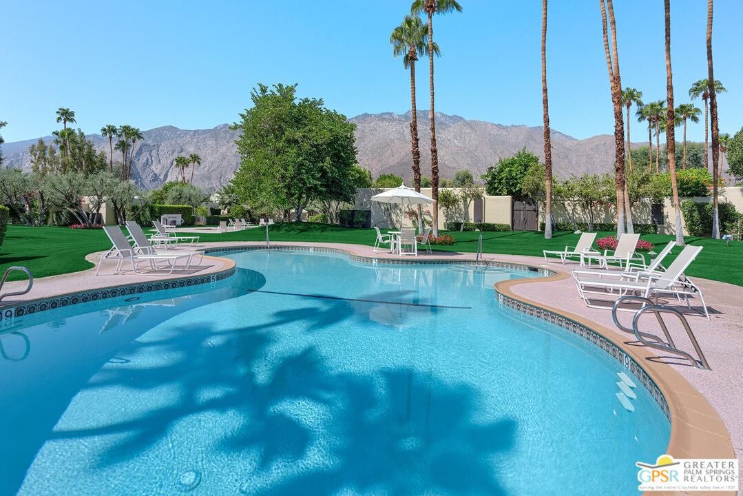 1177 East Alejo Road Palm Springs, CA 92262 - Photo 30 of 33 a view of a patio with a table and chairs