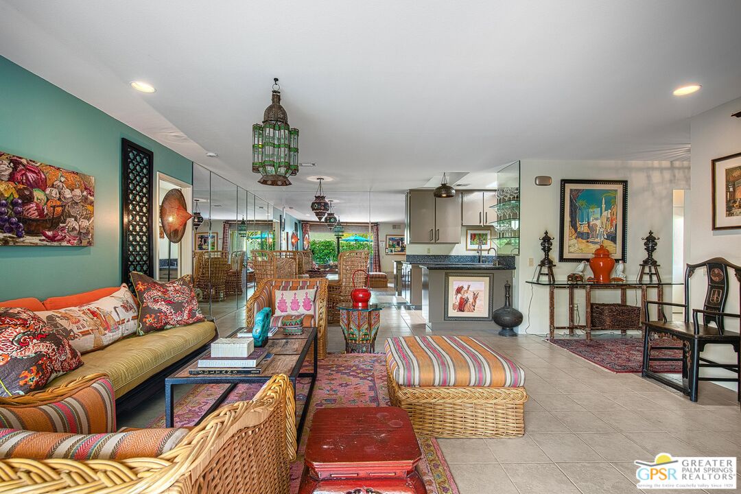 1177 East Alejo Road Palm Springs, CA 92262 - Photo 6 of 33 a living room filled with furniture and a flat screen tv